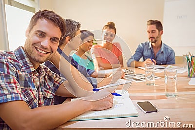 Casual businessman smiling at camera during meeting Stock Photo