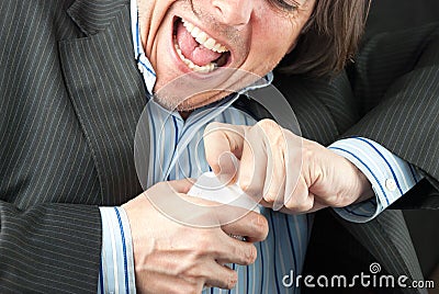 Casual Businessman Trying To Open Pill Bottle Stock Photo