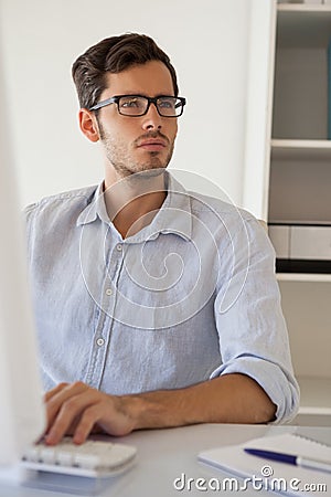 Casual businessman working at his desk Stock Photo