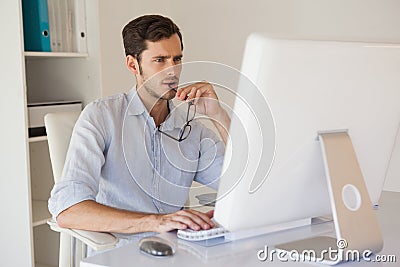 Casual businessman working at his desk Stock Photo