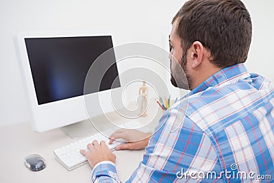 Casual businessman working at his desk Stock Photo