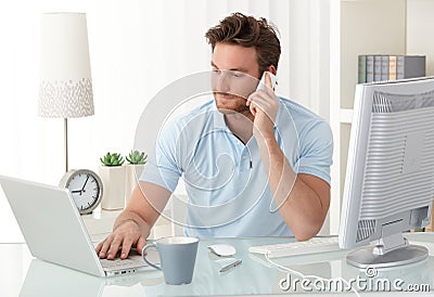 Casual businessman working in office Stock Photo