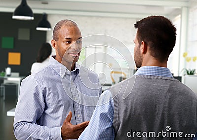 Casual businessmen talking at office Stock Photo