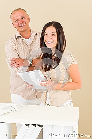 Casual businesswoman and businessman smiling Stock Photo