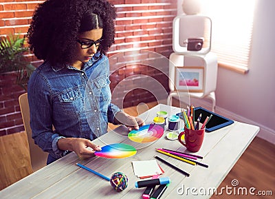 Casual businesswoman holding two color wheel Stock Photo