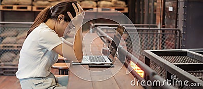 Casual businesswoman serious and concerned with laptop computer, asian woman stressed and tired from work in workspace or cafe. Stock Photo