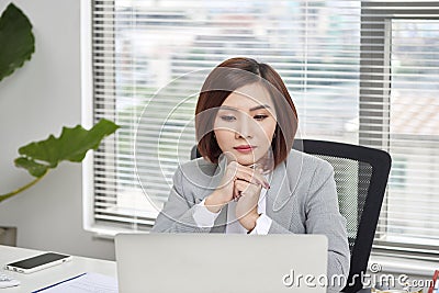 Casual businesswoman thinking about possibility of seeking new business opportunities Stock Photo