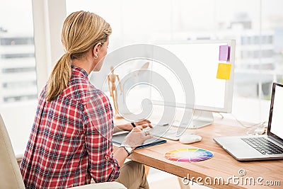 Casual designer working with digitizer and computer Stock Photo