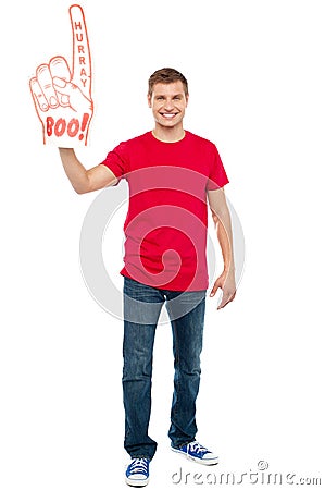 Casual guy showing large pointy boo hurray hand Stock Photo