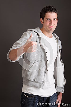 Casual guy thumbs up - success Stock Photo