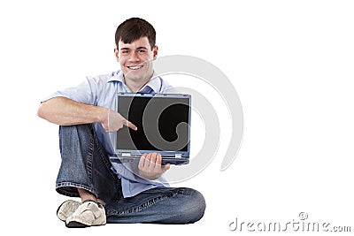 Casual man with laptop pointing at copy-space Stock Photo
