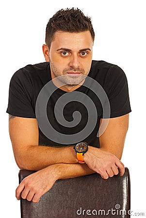 Casual man resting hands on seat Stock Photo