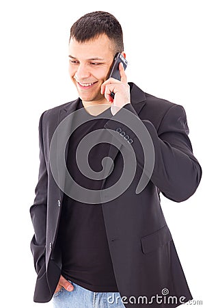 Casual man in a suit talking over mobile and smiling Stock Photo