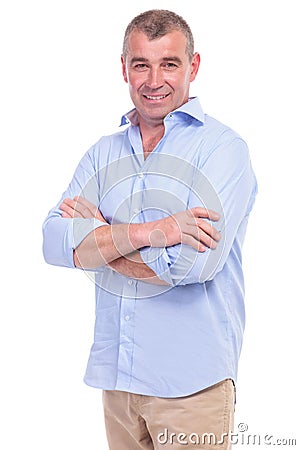 Casual middle aged man has his arms crossed Stock Photo