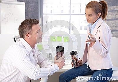 Casual office workers having coffee break chatting Stock Photo