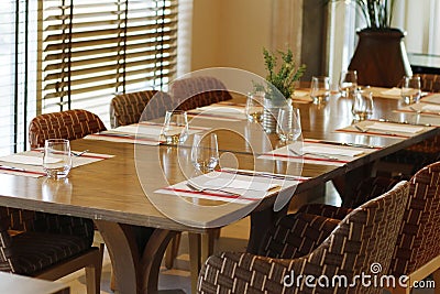 Casual restaurant dining table set up, with dark brown color theam Stock Photo