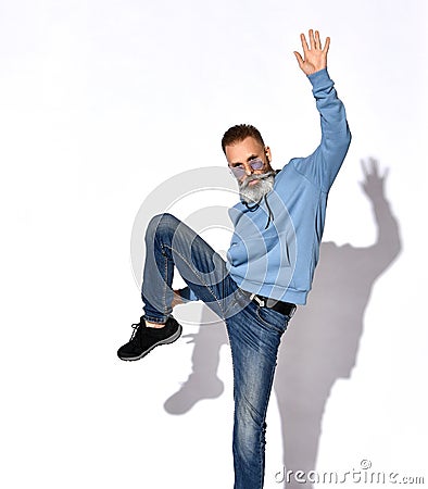 Casual stylish mature bearded man posing for camera Stock Photo