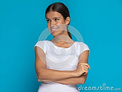 Casual woman with big smile on her face crossing arms Stock Photo
