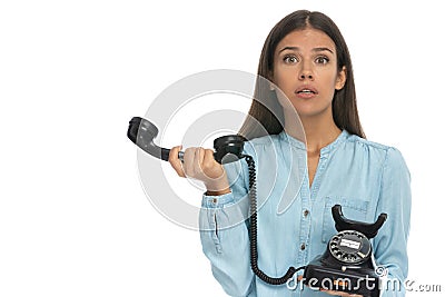 Casual woman feeling perplex over her phone conversation Stock Photo