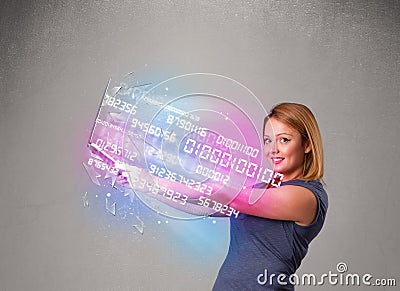 Casual woman holding laptop with exploding data and numers Stock Photo