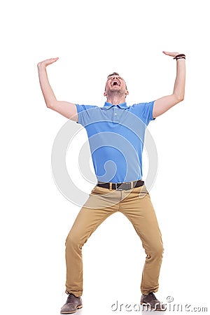 Casual young man holds something imaginary Stock Photo