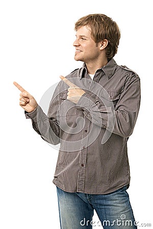 Casual young man pointing to blank space Stock Photo