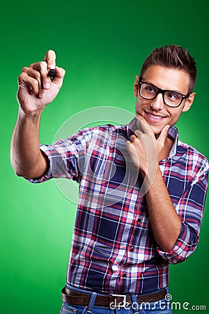 Casual young man writing with marker Stock Photo