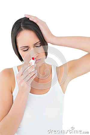 Casual young woman with bleeding nose Stock Photo