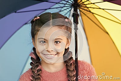Casually beautiful. Happy childhood. Autumn snuggles. Happy little girl with colorful umbrella. Autumn fashion for cute Stock Photo
