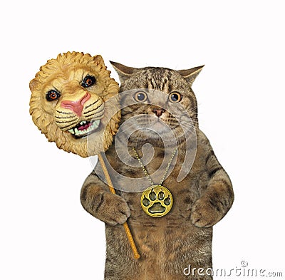 Cat holds lion carnival mask Stock Photo