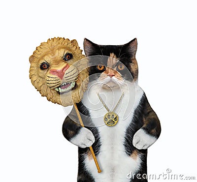 Cat holds lion carnival mask 4 Stock Photo