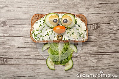 Cat made of bread and vegetables Stock Photo