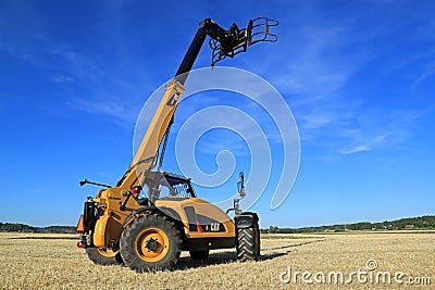 Cat TH407C Telescopic Handler on Stubble Field Editorial Stock Photo