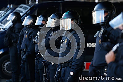 Catalan police mossos secure sants station outdoors during an independentist protest detail on officer Editorial Stock Photo