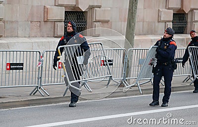 Catalan police securing area placing fences before president of government appears Editorial Stock Photo