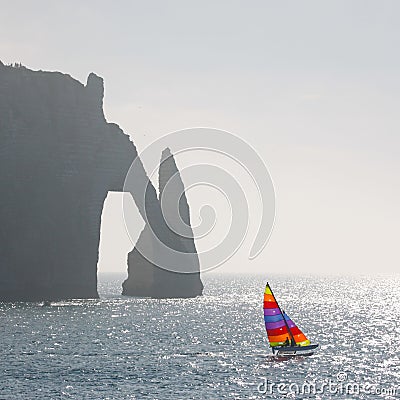 Catamaran and cliff Stock Photo