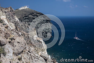 Catamaran from cliff at Akrotiri Stock Photo
