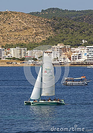 Catamaran Sailing Near Port Of San Antoni In Spain Editorial Stock Photo