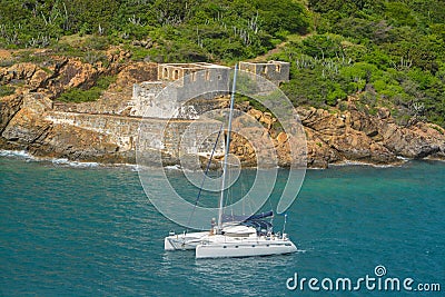 Catamaran sailing by Prince Frederikas Battery. Fort Willoughby on Hassel Island, St Thomas U.S. Virgin Islands. Editorial Stock Photo