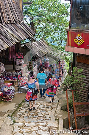 Tourists in traditional clothes in Catcat ethnic village Editorial Stock Photo