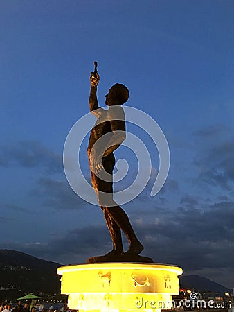 Catcher of a Cross monument illuminated at dusk, Lake Ohrid, Macedonia Stock Photo