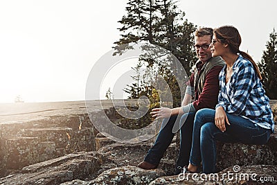 Catching up on our date. a loving couple taking a break while out exploring nature. Stock Photo