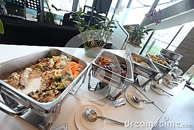 Catering Buffet served on table Deep Fried Fish Three Favor Souce, and many Thai Spicy Food in Buffet Catering Plate ready to Stock Photo