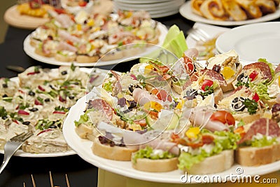 Catering, food service closeup, plates full of fresh tasty food and appetizers, company banquet concept, smorgasbord Stock Photo
