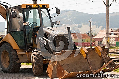Caterpillar bulldozer near rail road track Editorial Stock Photo