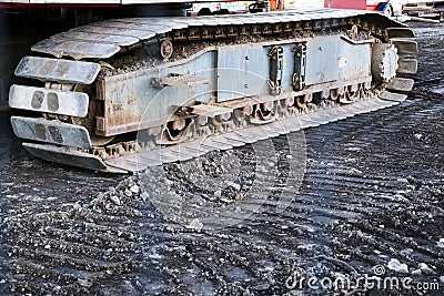 Caterpillar continuous tracks close up of digger on construction site Stock Photo