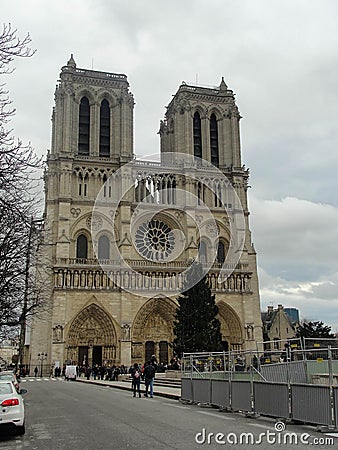 Cathedral of Notre Dame in Paris against the backdrop of a gray sky Editorial Stock Photo