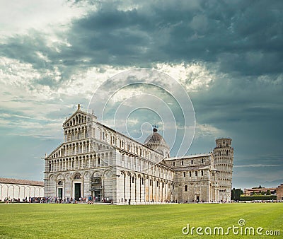 Cathedral of Pisa and Leaning Tower, Romanesque architecture in Tuscany. The bell tower of the cathedral is famous for its tilt Editorial Stock Photo