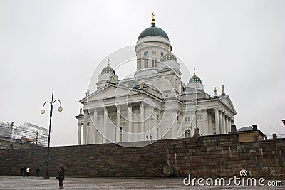 Cathedral on Senate Square in Helsinki, Finland. Side view. People walk around Editorial Stock Photo