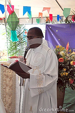 Priest speaking on Festa Junina Editorial Stock Photo